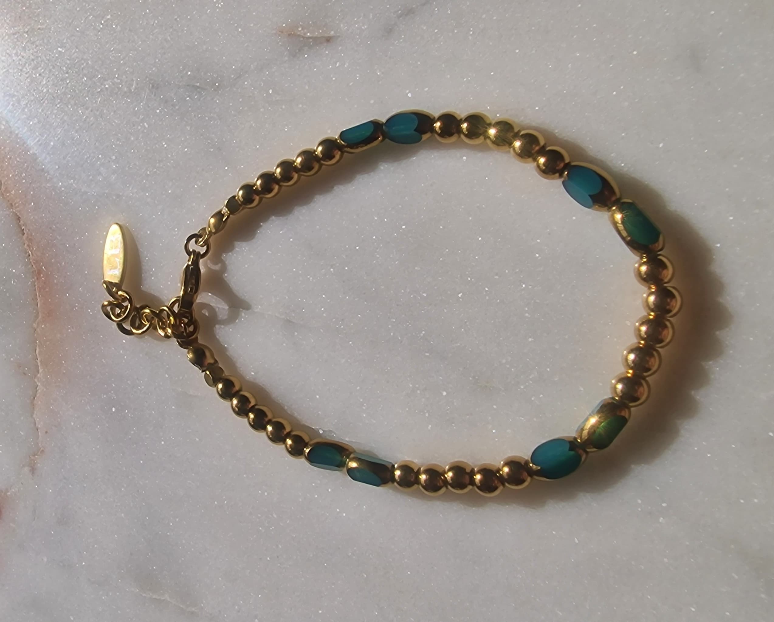 Turkoois ovaal facet met goud 4mm bracelet 3 9
